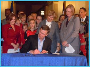 Governor Hickenlooper signs the Jake Snakenberg Youth Sports Concussion Act. Photo by Kenny Hosack.